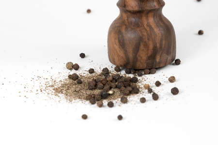 Black pepper with vintage millの写真素材