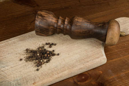 Black pepper with vintage millの写真素材