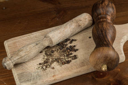 Black pepper with vintage millの写真素材