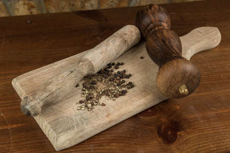 Black pepper with vintage millの写真素材