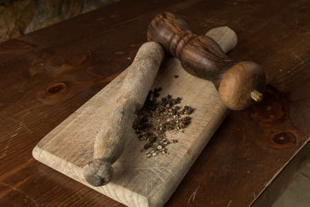 Black pepper with vintage millの写真素材