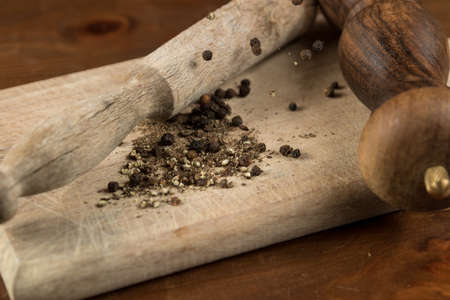 Black pepper with vintage millの写真素材