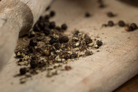 Black pepper with vintage millの写真素材