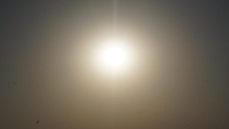 Sunset in the sky. Natural background. The sun shines through the clouds.の写真素材