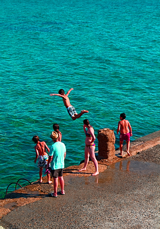 Jump. A dip in the Mediterranean seaの写真素材