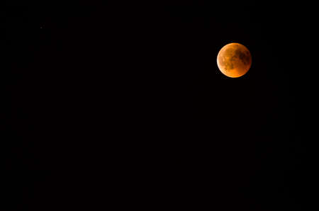 Red moon during an eclipse phase