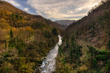 Mountain landscape with river running through itの写真素材