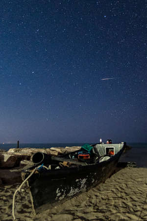 Beach and sea at night with starry sky