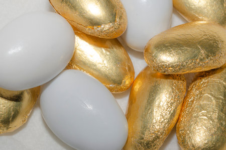 White and golden Sugared almonds backgroundの写真素材