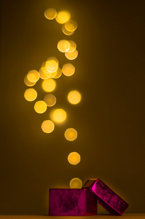 Open box from which magic lights come outの写真素材