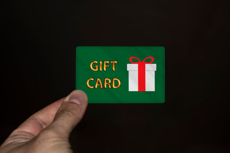 Hand holding a gift card
