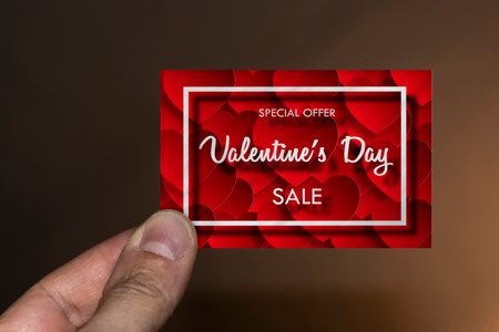 Hand with a Valentine's cardの写真素材