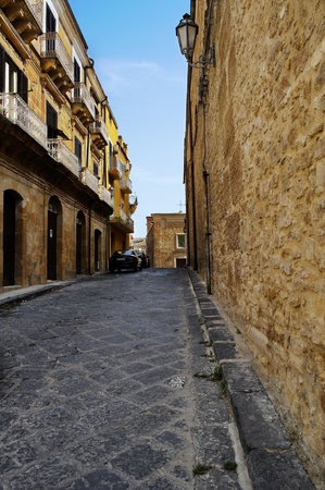 Perspective with church  Long and narrow street in Pietraperzia, Enna, Sicily, Italyの写真素材