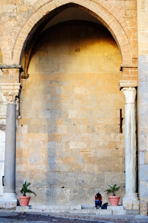Under a norman arch of the famous Cefalu cathedralの写真素材