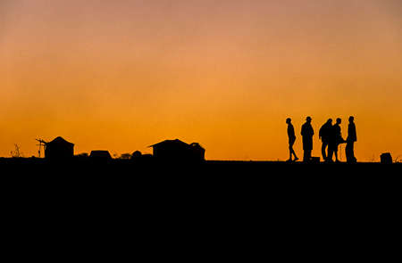 backlight at the sunset of herero people in Kaokoland, Namibiaの写真素材