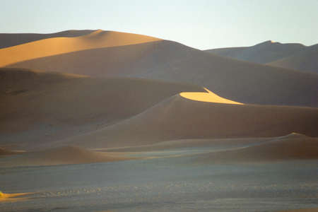 Panoramic view of red sand dunes in the famous Namib Desert in Namibiaの写真素材