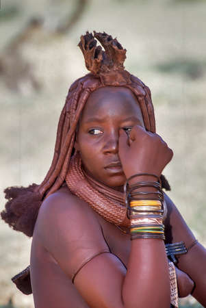 May 15, 2005. portrait of unidentified Himba woman  with the traditional hairstyle, necklace and the typical ochre tinted skin. Epupa Falls, Kaokoland or Kunene Province, Namibia, Africaのeditorial素材