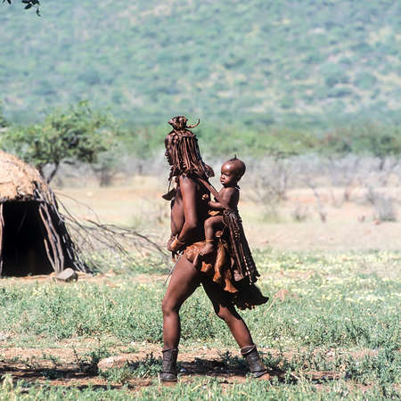 May 15, 2005.Himba village. unidentified Himba women with the traditional hairstyle, necklace and...
