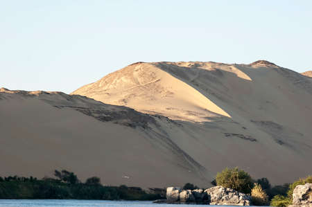 Abu Simbel, Aswan, Egypt - April 18 2008: the river Nile and the sand dunes in the backgroundのeditorial素材