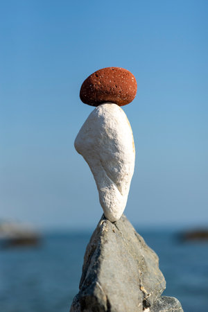 balanced stones on the rocks of the seaの写真素材