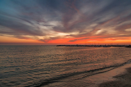 Sunset over the sea in Tuscany, Italyの写真素材