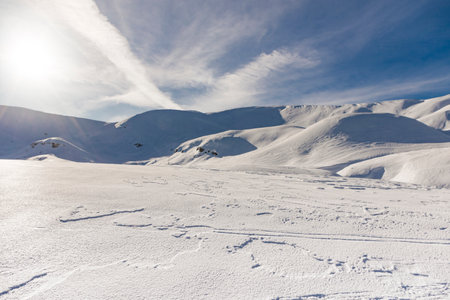 beautiful winter landscape with snow-capped mountains and blue sky