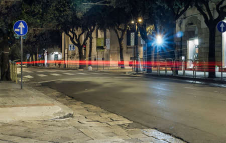 red light cars by nightの写真素材