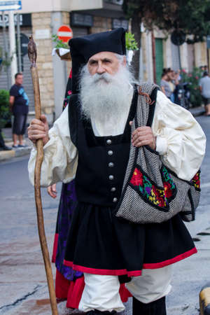QUARTU SE, ITALY - SEPTEMBER 16, 2017: Parade of Sardinian costumes and carts for the grape festival in honor of the celebrations of Saint Helena. - Sardiniaのeditorial素材