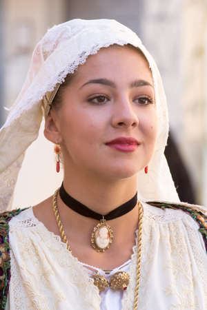 SELARGIUS, ITALY - SEPTEMBER 14, 2014: Ancient Selargino wedding, portrait of a beautiful woman wearing a traditional Sardinian costume - Sardiniaのeditorial素材