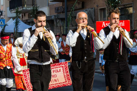 SELARGIUS, ITALY - SEPTEMBER 11, 2016: Ancient Selargino wedding, Launeddas musicians parading in traditional Sardinian costume - Sardiniaのeditorial素材