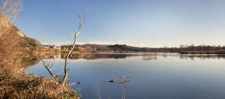 CALM LAKE LANDSCAPE  WITH ROOTSの写真素材