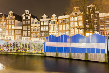 Amsterdam canal and the flower market at nightの写真素材