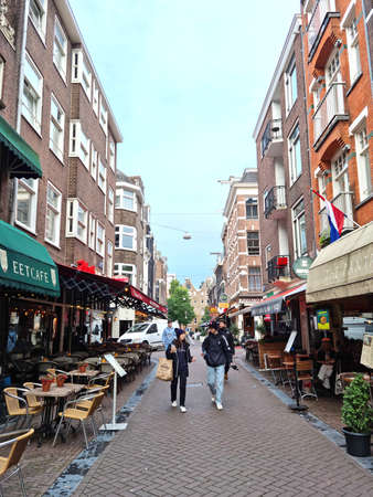 Amsterdam, The Netherlands - 03 October, 2021: People walking in the Lange Leidsedwarsstraat street. The street is close to the Leidseplein square and hosts several cafes, restaurants and bars.のeditorial素材