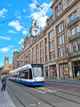 Amsterdam, The Netherlands - 03 October, 2021: People walking in the Damrak street. The street runs north-south, connecting the Central Station and the Dam square.のeditorial素材