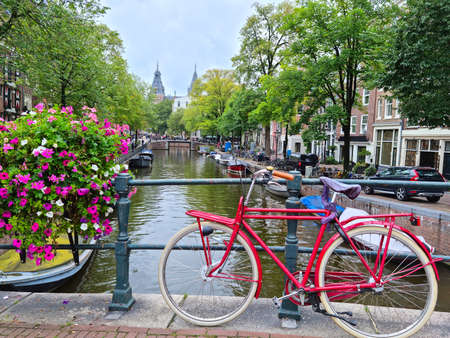 Amsterdam canal and bicycles, The Netherlandsの写真素材