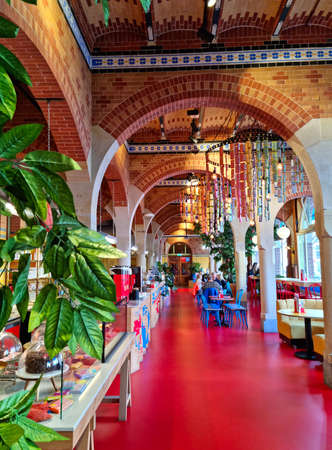 Amsterdam, The Netherlands - 05 October, 2021: People eating in the Tony's Chocolonely Chocolate Bar. The  Dutch confectionery is one of the country's largest chocolate manufacturers.のeditorial素材