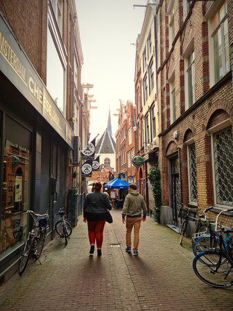 Amsterdam, The Netherlands - 03 October, 2021: People walking in the center of Amsterdam. The city is home to a large variety of restaurants, cafes and terraces.のeditorial素材