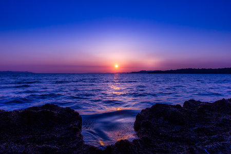 A sunset over the oceanの写真素材