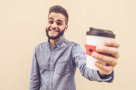 Self portrait of a guy with coffeeの写真素材