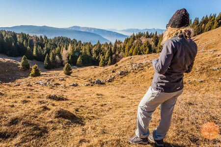 Cansiglio, Veneto, Italy; 2016 - 12 30: girl watching beautiful landscapeのeditorial素材