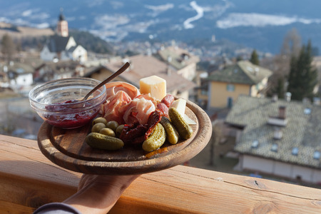 Mountain wooden plate of italian lunch, Fiemme Valley, Trentino, Italyの写真素材