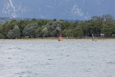 FARRA D'ALPAGO, ITALY  JUNE 30, 2017: 2017 windsurf world championship. Concurrents training before the raceのeditorial素材