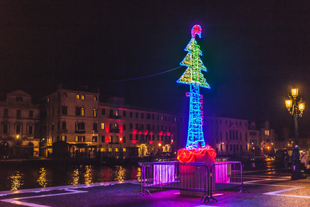 VENICE, ITALY - JANUARY 02 2018: colorful christmas tree made of lights in the square in front of train stationのeditorial素材
