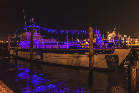 VENICE, ITALY - JANUARY 02 2018: boat with christmas decoration moored at night in front of Basilica della Salute.のeditorial素材