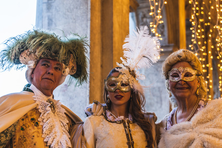 VENICE, ITALY - FEBRUARY 10 2018: Five hundred century carnival masks posing for photographers in San Marco squareのeditorial素材
