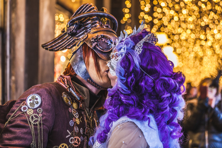 VENICE, ITALY - FEBRUARY 10 2018: Kiss between two carnival masks dressed with imaginative patternsのeditorial素材