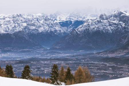 Panorama of dolomite valleys with fogs on a gray day tilt shift effect, Belluno, Italyの写真素材