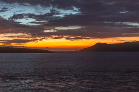 Beautiful sunset on Nea Kameni and Therasia islandの写真素材