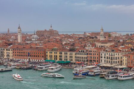 View of the San Marco Basin with boats moored to the shore
