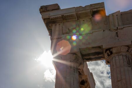 Detail of the Parthenons columns with sun rays in the backgroundの写真素材